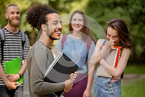 Group of college students latinamerican boy on foreground.