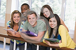 Group of college students leaning on banister photo