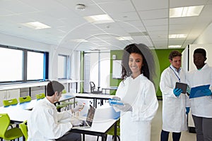 Group Of College Students In Science Class With Experiment