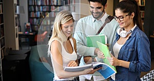 Group of college students studying in the school library