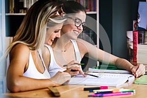 Group of college students studying in the school library