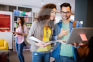 Group of college students studying in the school library