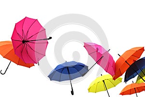 Group of color umbrellas on white background
