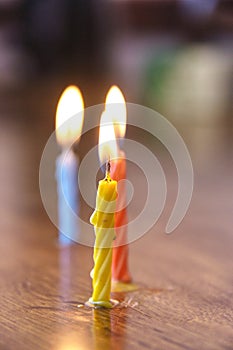 Group of colorful fire candles on table