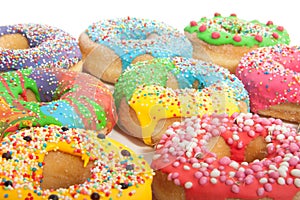 A group of colorful glazed donuts