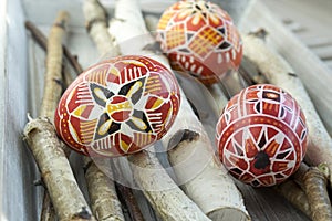Group of colorful painted Easter eggs on birch branches