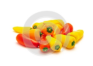 Group of colorful red, yellow and orange mini sweet peppers snack isolate on white