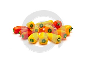 Group of colorful red, yellow and orange mini sweet peppers snack isolate on white