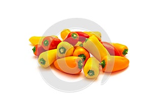 Group of colorful red, yellow and orange mini sweet peppers snack isolate on white