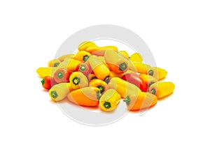 Group of colorful red, yellow and orange mini sweet peppers snack isolate on white