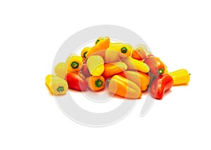 Group of colorful red, yellow and orange mini sweet peppers snack isolate on white