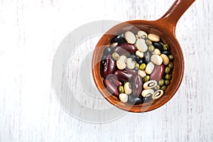 Group of colorful various beans in ceramic bowl