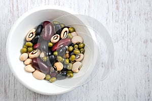 Group of colorful various beans in ceramic bowl