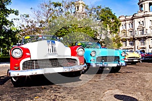 Group of colorful vintage classic cars parked in Old Havana