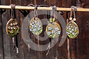 Group of colourful hand painted mixed necklaces and suvenirs displayed for sale at a traditional weekend market in Bucharest,