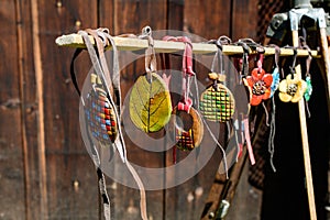 Group of colourful hand painted mixed necklaces and suvenirs displayed for sale at a traditional weekend market in Bucharest,