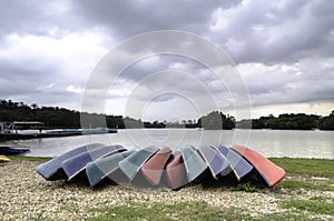 Group of colourful kayaks on the shore of lake