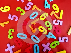 A group of colourful plastic numbers for numeration learning. Education and fun learning concept