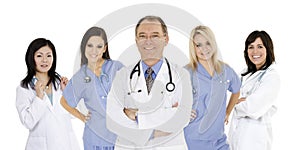 Group of confident doctors and nurses with their arms crossed displaying some attitude isolated on white background