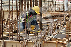 Group of construction workers fabricating ground beam formwork