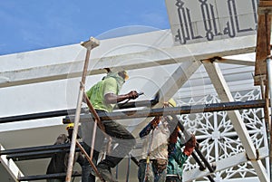 Group of construction workers working at high level at the construction site