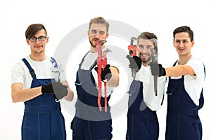 Group of construction workers with working tools