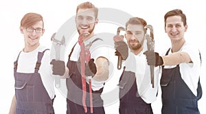 Group of construction workers with working tools