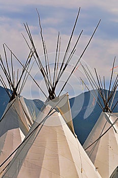 A group of contemporary canvas Indian lodges