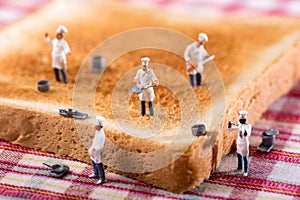 Group of cooks or chefs on a slice of white toast