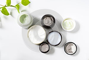 Group of Cosmetic clay mask in bottle on white background.Beauty skin care concept.Top view