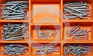 Group of countersunk lag screws in a box