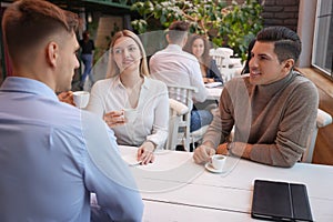 Group of coworkers having coffee break