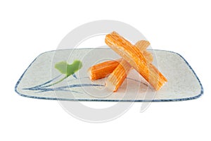 Group crab stick with wasabi sause on plate