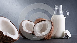 Group of cracked coconut fruit and coconut milk