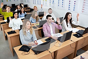 Group of curious students in class