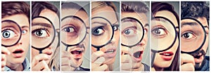 Group of curious women and men looking through a magnifying glass
