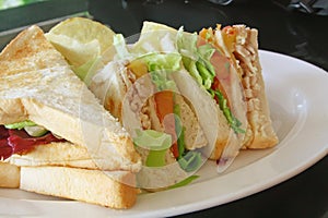 Group of Cut Toasted Sandwiches photo