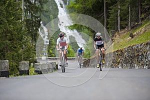Group cycling uphill photo