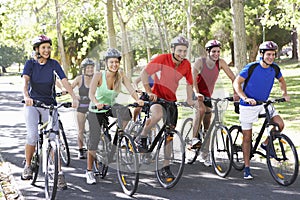 Group Of Cyclists On Cycle Ride Through Park