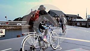 Group of cyclists pedaling through Copenhagen city street, transport in Denmark