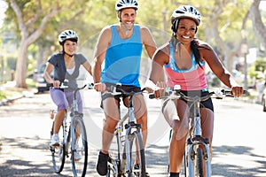 Group Of Cyclists On Suburban Street