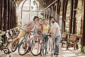 Group of cyclists taking selfie with monopod.