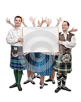 Group of dancers of Scottish dance with empty banner