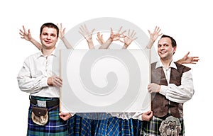 Group of dancers of Scottish dance with empty banner