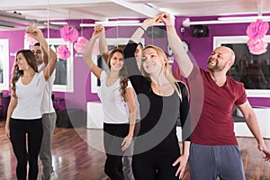 Group dancing in club photo