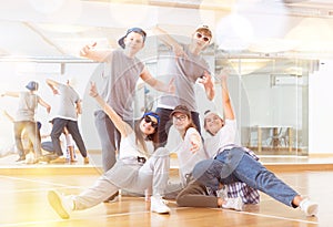 Group of dancing teenagers posing in dance studio