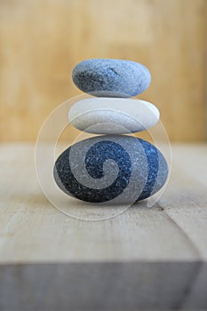 Group of dark white and grey pebbles, one cairn