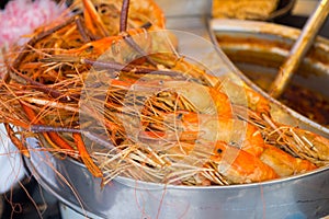 group of delicious streaming jumbo shrimps prawn in Thai street