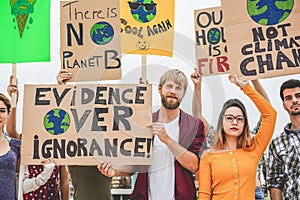 Group of demonstrators on road, young people from different culture and race fight for climate change - Global warming and