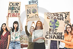 Group of demonstrators on road, young women from different culture and race fight for climate change - Global warming and